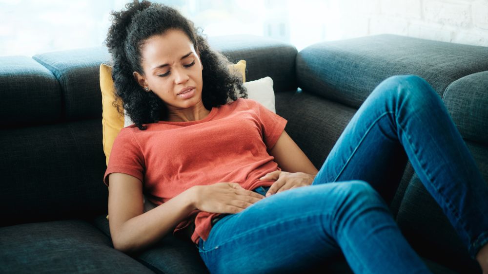 woman suffering menstrual cramps